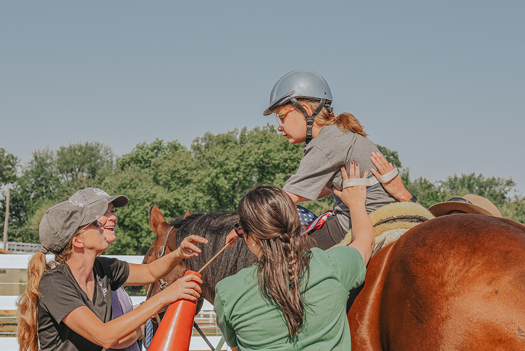 volunteers are helping a girl