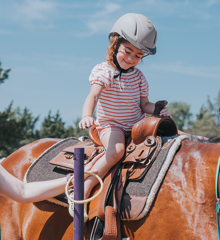 happy little girl riding with smile